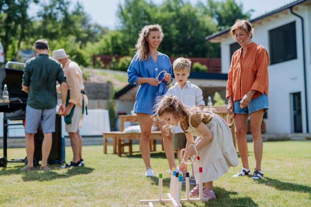 family spending time in the yard during summer
