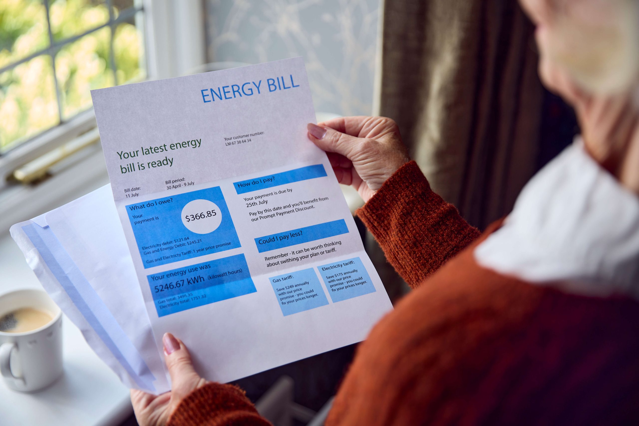over the shoulder view of person looking at an energy bill