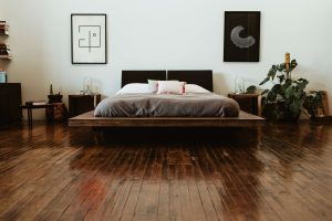 modern bedroom with dark wooden floors